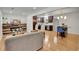 Open concept living room features modern fireplace and adjacent kitchen at 6914 Fairway Trl, Austell, GA 30168