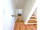 Bright staircase features hardwood floors with white walls leading to the upper levels of the house at 6914 Fairway Trl, Austell, GA 30168