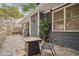 Private backyard with fire pit, patio furniture, and grill at 956 Cardova Dr, Atlanta, GA 30324