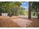 Landscaped backyard with brick patio and shed at 956 Cardova Dr, Atlanta, GA 30324