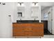 Bathroom with double vanity, wood cabinets, and black countertops at 956 Cardova Dr, Atlanta, GA 30324