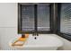 Elegant bathroom with a freestanding tub, modern fixtures, and subway tile at 956 Cardova Dr, Atlanta, GA 30324