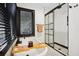 Spa-like bathroom with soaking tub, frameless glass shower, and black accents at 956 Cardova Dr, Atlanta, GA 30324