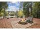 Relaxing fire pit area with seating in a wooded setting at 956 Cardova Dr, Atlanta, GA 30324