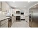 Updated kitchen featuring stainless steel appliances and light gray cabinets at 956 Cardova Dr, Atlanta, GA 30324