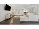 Spacious living area with dark hardwood floors, sectional sofa, and a modern fireplace at 956 Cardova Dr, Atlanta, GA 30324