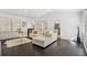 Open concept living room with dark hardwood floors and large windows at 956 Cardova Dr, Atlanta, GA 30324