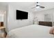 Main bedroom with large TV, king bed, and dark wood floors at 956 Cardova Dr, Atlanta, GA 30324