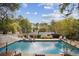 Large inground pool in a wooded backyard setting at 956 Cardova Dr, Atlanta, GA 30324