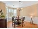 Formal dining room with hardwood floors, bay window, and chandelier at 5030 Bayrose Cir # 30A, Atlanta, GA 30344