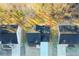 Overhead view of home with dark roof, surrounded by mature trees in autumn at 6478 Beaver Creek Trl, Atlanta, GA 30349