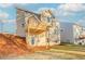 The backyard features a multilevel deck and walkout basement door of this two-story home at 6478 Beaver Creek Trl, Atlanta, GA 30349