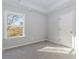 Spacious bedroom with grey carpet and large window at 6478 Beaver Creek Trl, Atlanta, GA 30349