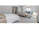 Bright bedroom featuring carpet, sitting area, desk, and natural light at 6478 Beaver Creek Trl, Atlanta, GA 30349
