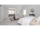 Bright bedroom featuring carpet, sitting area, desk, and natural light at 6478 Beaver Creek Trl, Atlanta, GA 30349