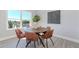 Well-lit dining room features a large window and modern decor and artwork at 6478 Beaver Creek Trl, Atlanta, GA 30349