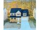 Charming two-story home with a welcoming front porch and a two-car garage at 6478 Beaver Creek Trl, Atlanta, GA 30349