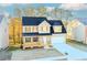 Charming two-story home with a welcoming front porch and a two-car garage at 6478 Beaver Creek Trl, Atlanta, GA 30349