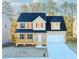 Charming two-story home with a welcoming front porch and a two-car garage at 6478 Beaver Creek Trl, Atlanta, GA 30349