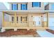 Charming front porch with wooden railings and steps at 6478 Beaver Creek Trl, Atlanta, GA 30349