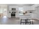 Bright kitchen featuring white cabinets, stainless steel appliances, and a granite countertop island with seating at 6478 Beaver Creek Trl, Atlanta, GA 30349