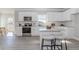 Contemporary kitchen features granite countertops, stainless steel appliances, and barstool seating at 6478 Beaver Creek Trl, Atlanta, GA 30349