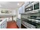 Modern kitchen with grey cabinets and stainless steel appliances at 2077 Oakleaf Ln, Lithia Springs, GA 30122