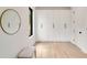 Bedroom featuring white built in closet storage, hardwood floors, and large windows at 247 Huntington Ne Rd, Atlanta, GA 30309