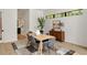 Bright dining room with a modern light fixture, neutral walls, and light wood floors at 247 Huntington Ne Rd, Atlanta, GA 30309