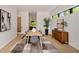 Modern dining room with light wood floors and sleek furniture at 247 Huntington Ne Rd, Atlanta, GA 30309