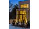 Modern brick home with large windows and staircase visible through glass doors at 247 Huntington Ne Rd, Atlanta, GA 30309