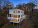 Modern three-story house with expansive windows offering beautiful interior views and abundant natural light at 247 Huntington Ne Rd, Atlanta, GA 30309