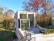 Contemporary brick home featuring large windows and a tiered patio with lush natural surroundings at 247 Huntington Ne Rd, Atlanta, GA 30309