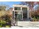 Beautiful modern home with a light brick facade and large windows, complete with a walkway and landscaping at 247 Huntington Ne Rd, Atlanta, GA 30309