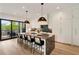 Gourmet kitchen boasts large island with seating, stone counters, and modern appliances at 247 Huntington Ne Rd, Atlanta, GA 30309