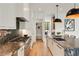 Well-appointed kitchen with professional-grade appliances and granite countertops at 247 Huntington Ne Rd, Atlanta, GA 30309