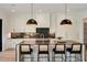 Modern kitchen featuring granite countertops and black and gold lighting at 247 Huntington Ne Rd, Atlanta, GA 30309