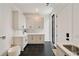 Bright laundry room features sleek cabinetry, stylish tile, and a utility sink at 247 Huntington Ne Rd, Atlanta, GA 30309
