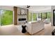 Bright living room featuring large windows, fireplace, and open floor plan, perfect for modern living and entertaining at 247 Huntington Ne Rd, Atlanta, GA 30309