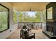 Charming outdoor patio with comfortable seating and a fireplace, perfect for enjoying serene views at 247 Huntington Ne Rd, Atlanta, GA 30309