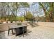 Outdoor patio with a dining set, steps, and brick wall, perfect for entertaining or relaxing at 247 Huntington Ne Rd, Atlanta, GA 30309