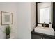 Powder room featuring vessel sink, modern fixtures, and a decorative mirror at 247 Huntington Ne Rd, Atlanta, GA 30309