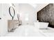 Luxurious bathroom featuring a modern soaking tub, dual vanities, and a stylish accent wall, perfect for relaxation at 5483 Wylstream, Norcross, GA 30093
