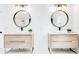 Elegant bathroom showcasing double vanities with modern fixtures, round mirrors, and stylish lighting at 5483 Wylstream, Norcross, GA 30093