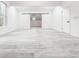 Spacious bonus room with gray flooring and modern sliding barn doors to an additional room at 5483 Wylstream, Norcross, GA 30093