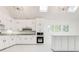 Bright kitchen with white cabinets, quartz countertops, and stainless appliances at 5483 Wylstream, Norcross, GA 30093