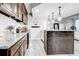 Modern kitchen featuring granite countertops, stainless steel appliances, and stylish lighting at 5483 Wylstream, Norcross, GA 30093