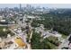 An aerial view of a city skyline with new construction and a cityscape filled with green trees at 1005 Sims Nw Ave, Atlanta, GA 30318