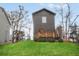 Backyard view of a modern home featuring a wood deck and ample green space at 1005 Sims Nw Ave, Atlanta, GA 30318