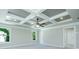 Spacious primary bedroom featuring a coffered ceiling, fan, plush carpet, and natural light at 5380 Deer Run Dr, Conyers, GA 30094